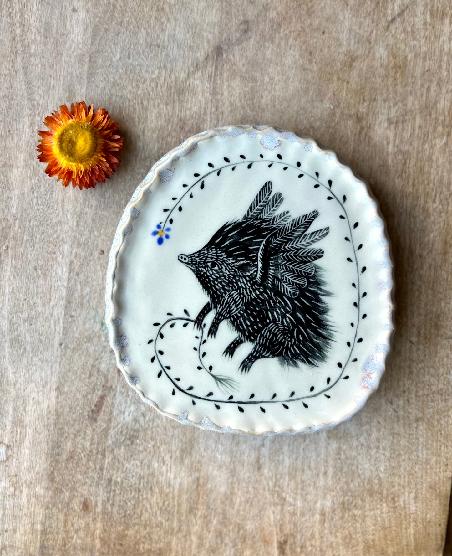 Flying hedgehog wall hanging